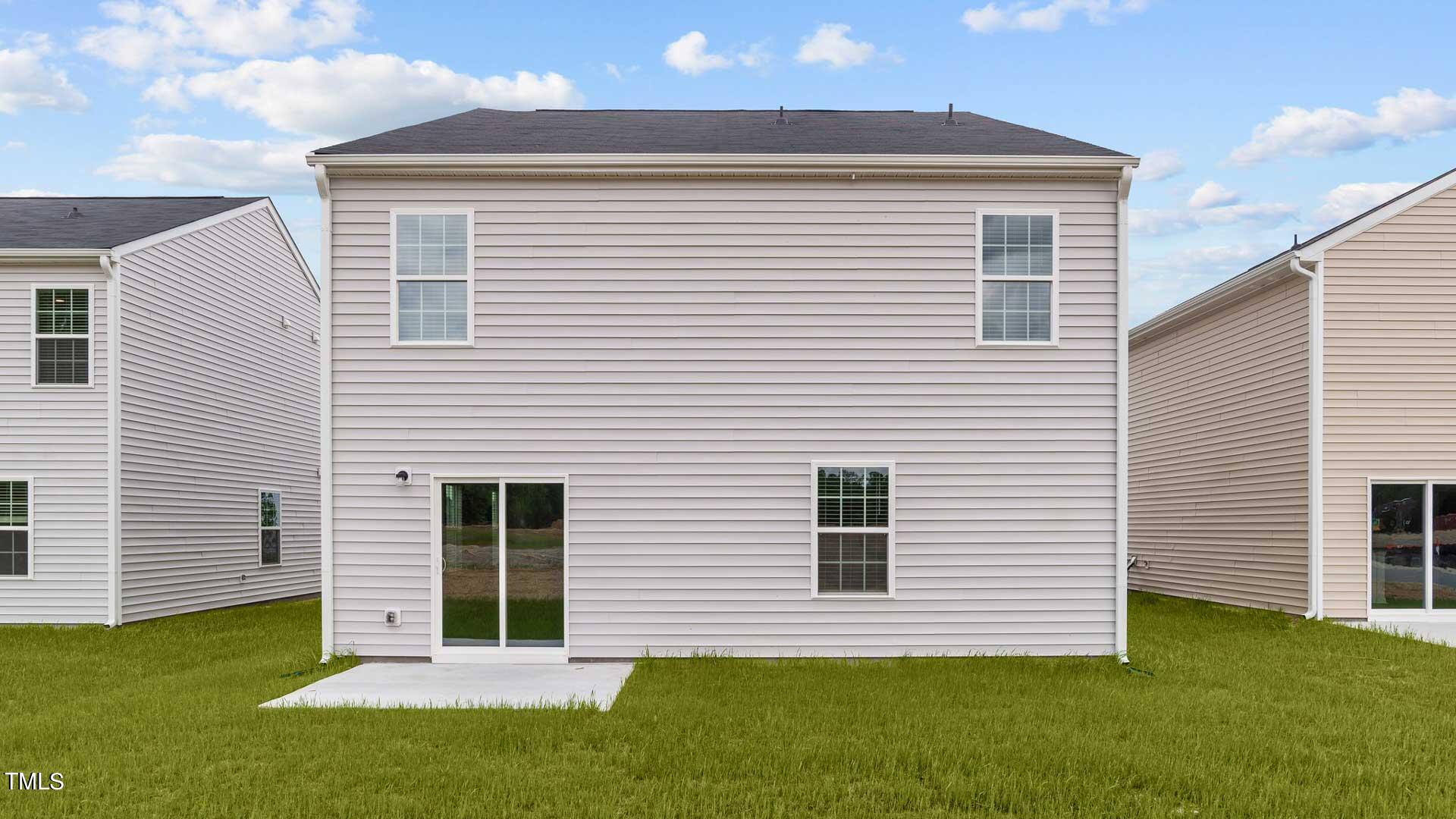 210 River Bank Road Fuquay-Varina, NC 27526 - Photo 34 of 36 a view of a house with a backyard