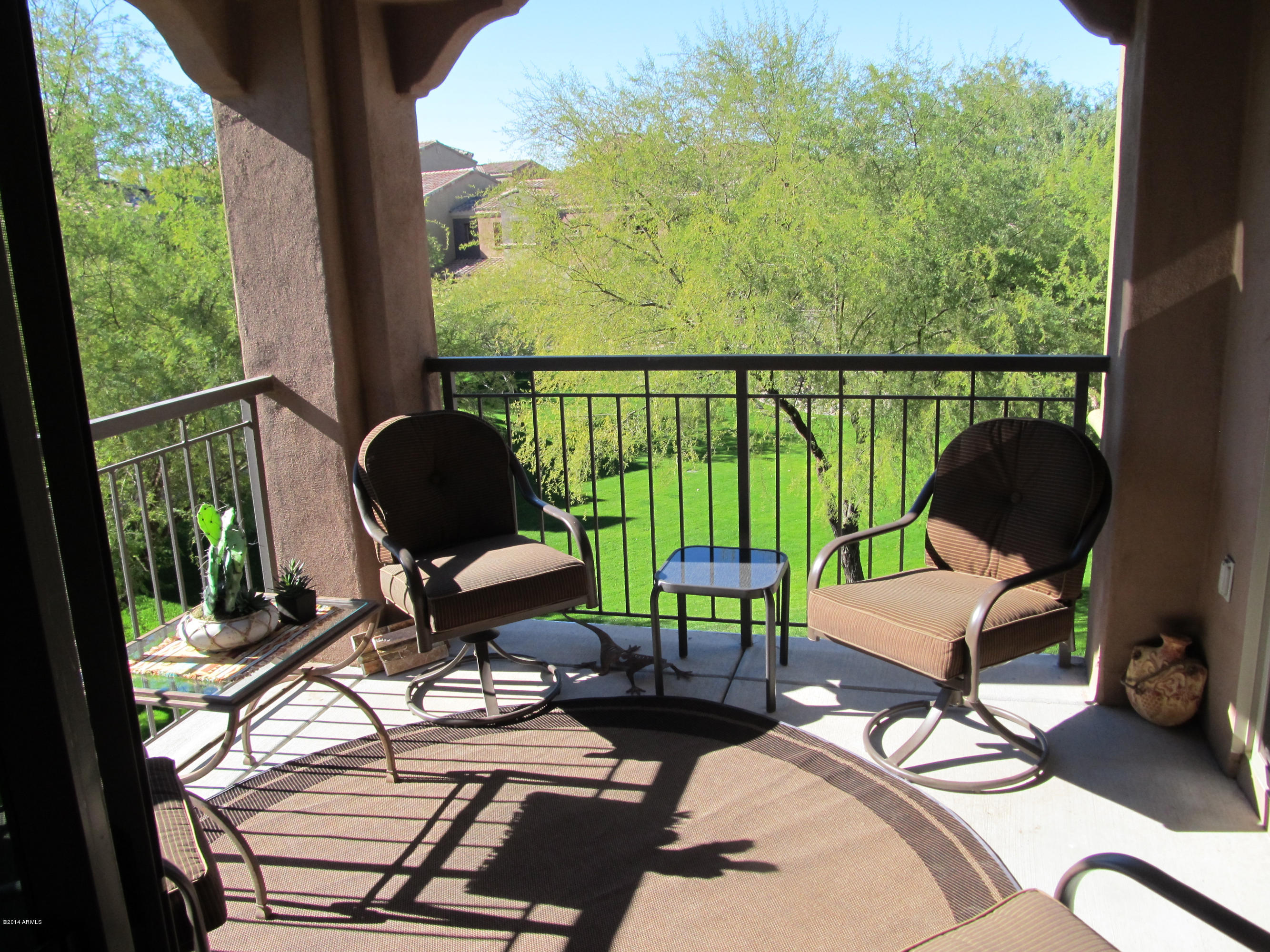 3935 East Rough Rider Road, Unit 1358 Phoenix, AZ 85050 - Photo 11 of 15 a view of a chairs in balcony