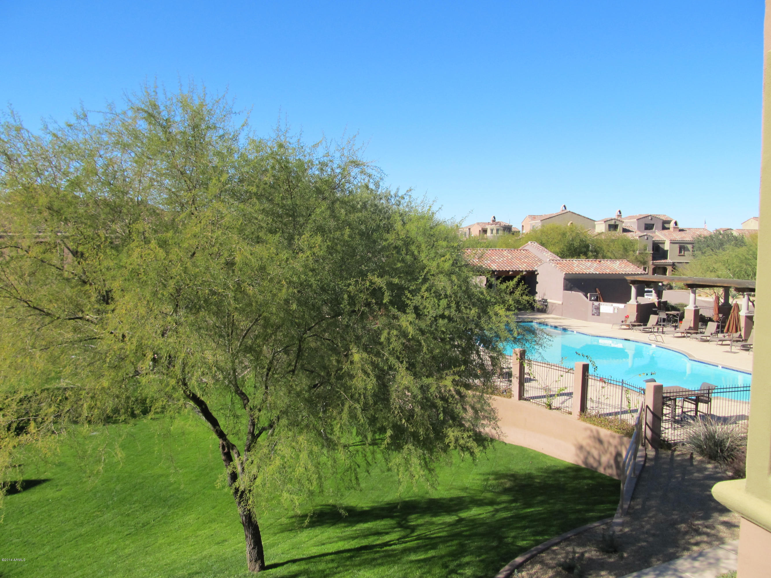 3935 East Rough Rider Road, Unit 1358 Phoenix, AZ 85050 - Photo 12 of 15 a view of a lake with a garden