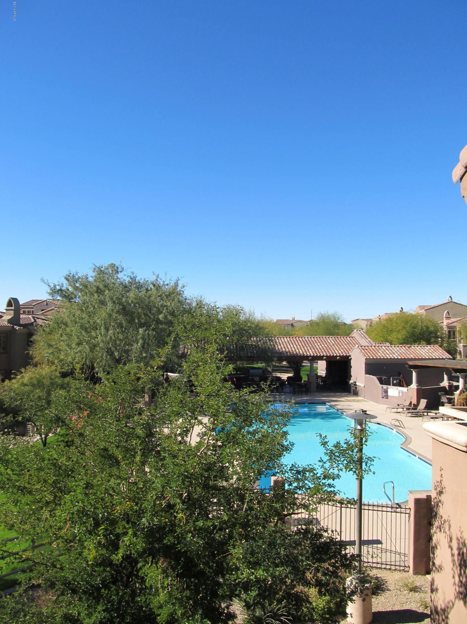 3935 East Rough Rider Road, Unit 1358 Phoenix, AZ 85050 - Photo 8 of 15 a view of a lake with houses