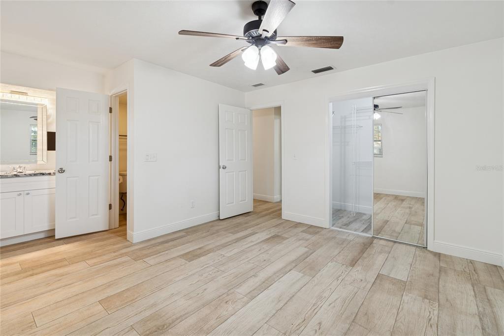 9628 Davis Road Tampa, FL 33637 - Photo 22 of 44 wooden floor in an empty room with a window