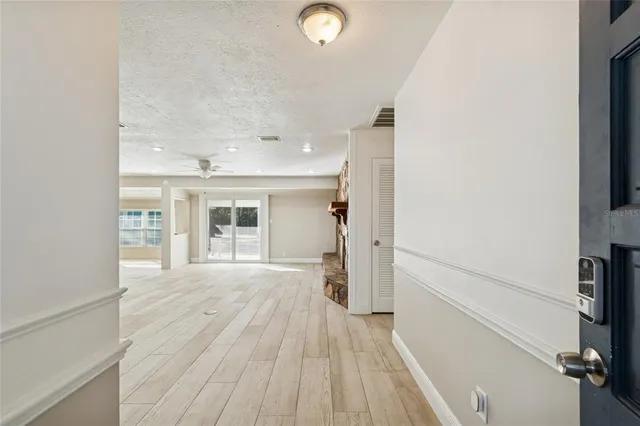 wooden floor in an empty room and a window