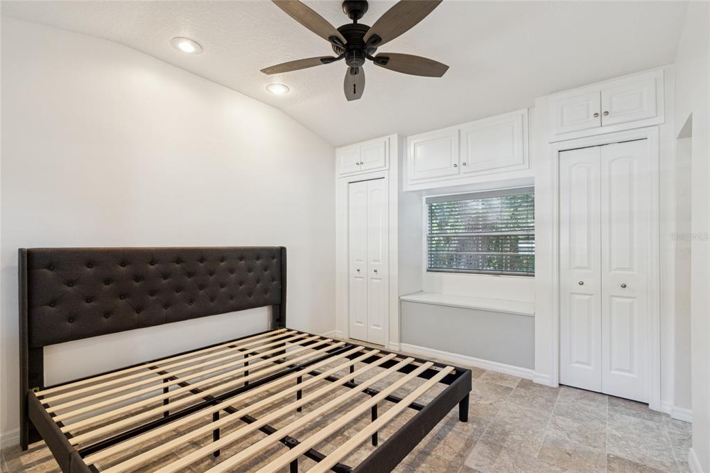 9628 Davis Road Tampa, FL 33637 - Photo 32 of 44 a bedroom with a bed and a window