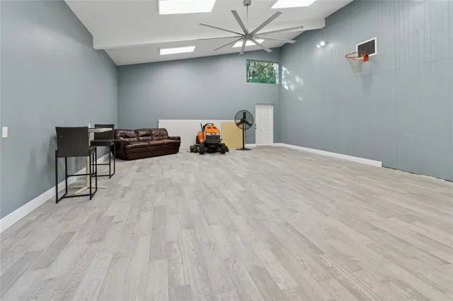 a view of a livingroom with a hardwood floor and a ceiling fan