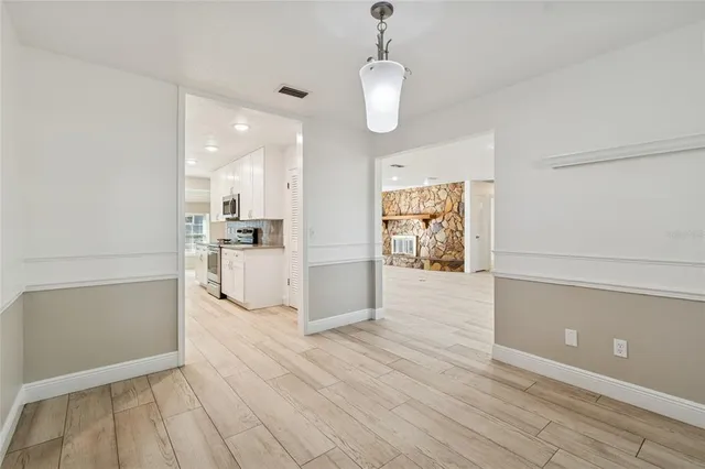 a view of a kitchen with wooden floor