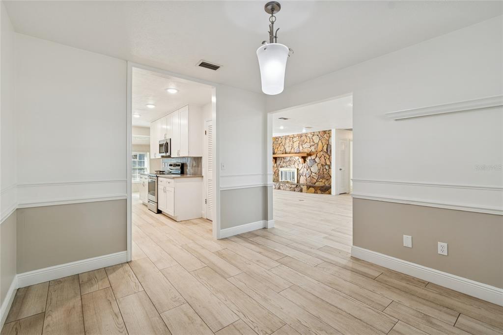 9628 Davis Road Tampa, FL 33637 - Photo 8 of 44 a view of a kitchen with wooden floor