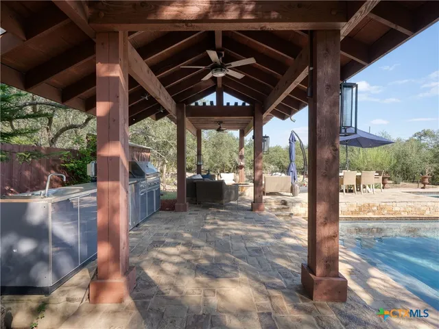a outdoor space with patio the couches and a fire pit