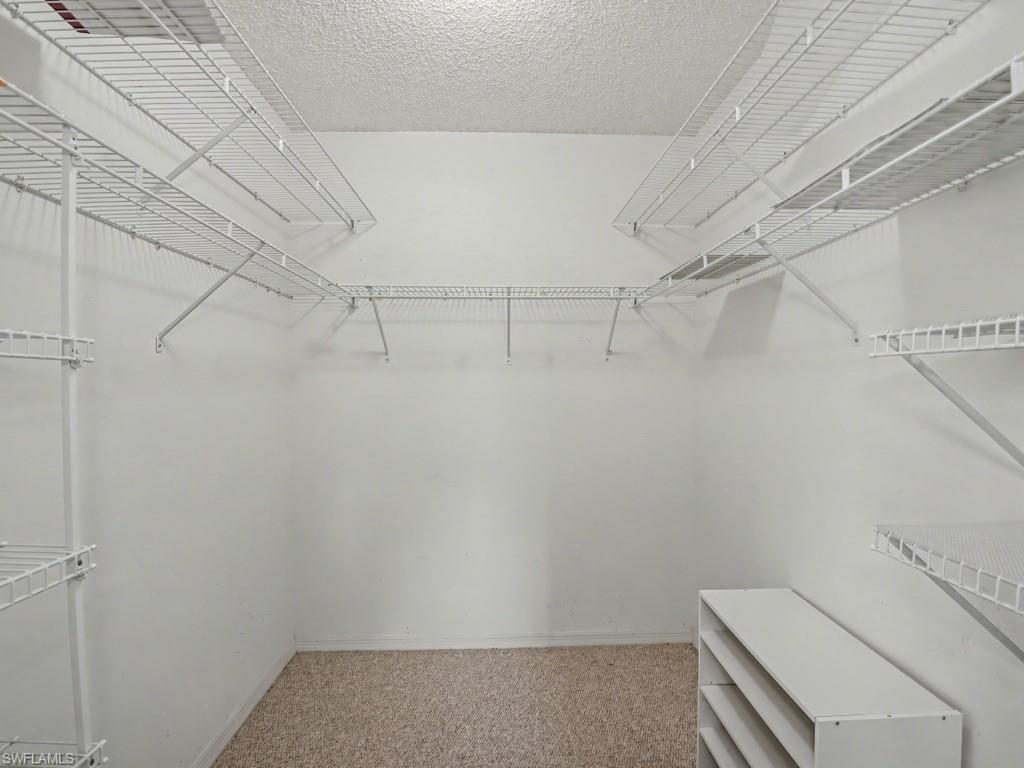 565 Augusta Boulevard, Unit 10 Naples, FL 34113 - Photo 11 of 16 a view of a room with racks on the wall
