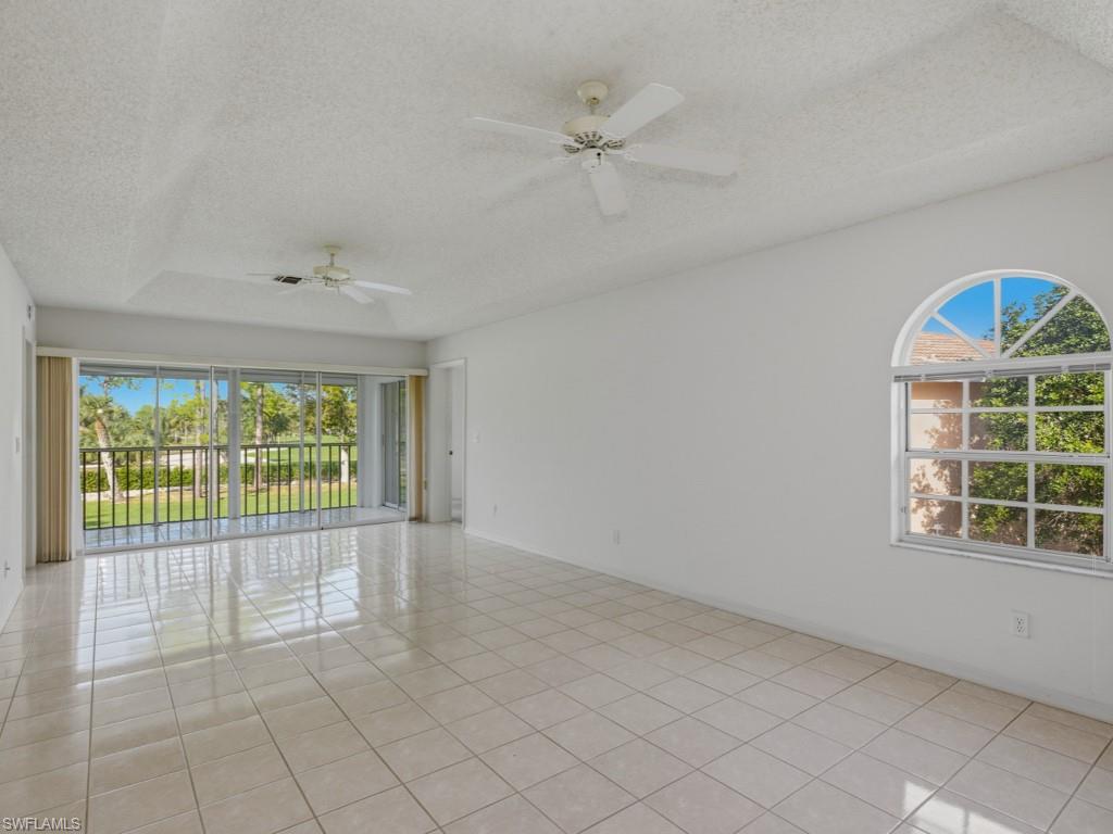 565 Augusta Boulevard, Unit 10 Naples, FL 34113 - Photo 3 of 16 an empty room with windows