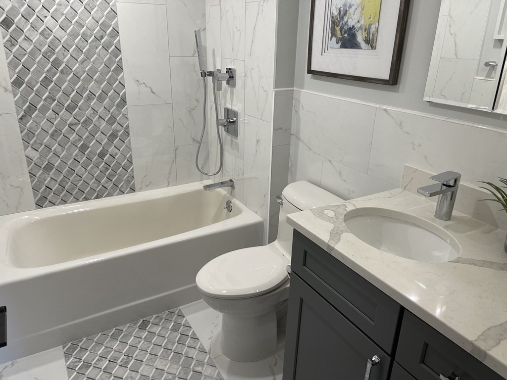 11 Rustlewood Road Boston, MA 02132 - Photo 15 of 31 a bathroom with a sink toilet and bathtub