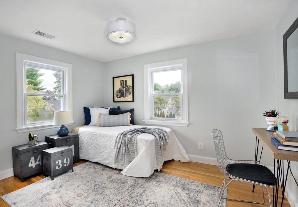 11 Rustlewood Road Boston, MA 02132 - Photo 20 of 31 a bedroom with a bed and a window