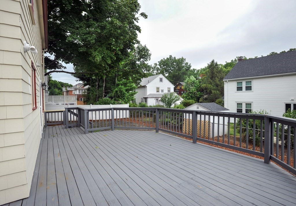 11 Rustlewood Road Boston, MA 02132 - Photo 23 of 31 a view of deck with wooden floor and fence and trees