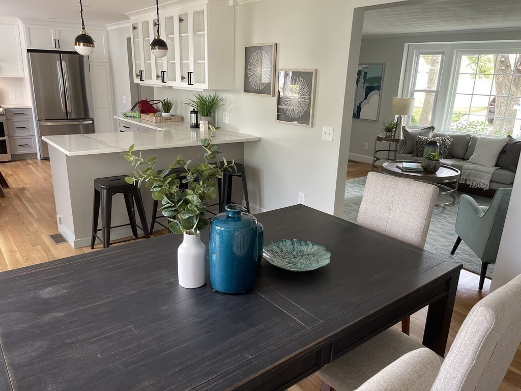 11 Rustlewood Road Boston, MA 02132 - Photo 8 of 31 a view of a dining room with furniture and a potted plant