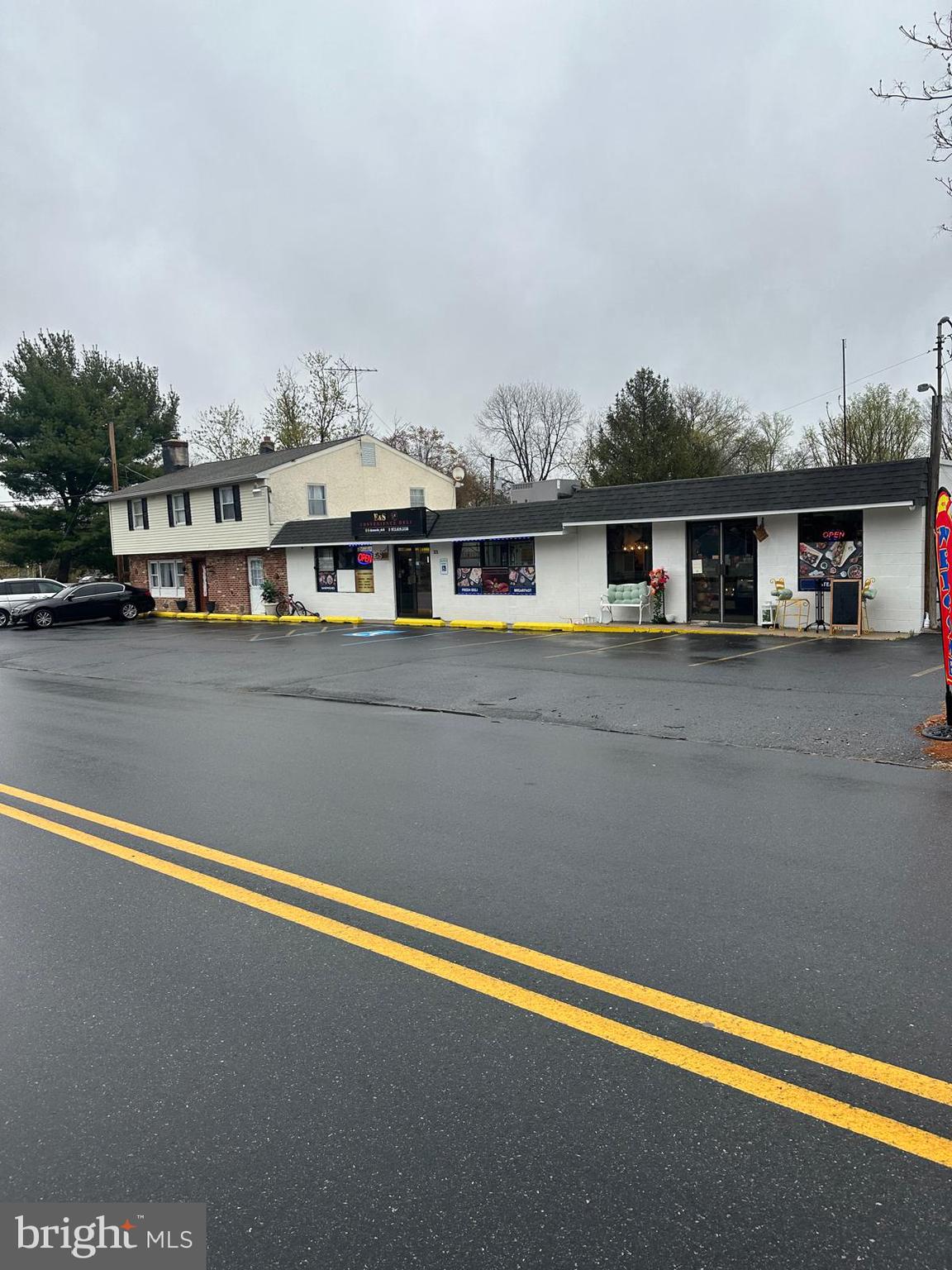 a front view of a house with a lake view