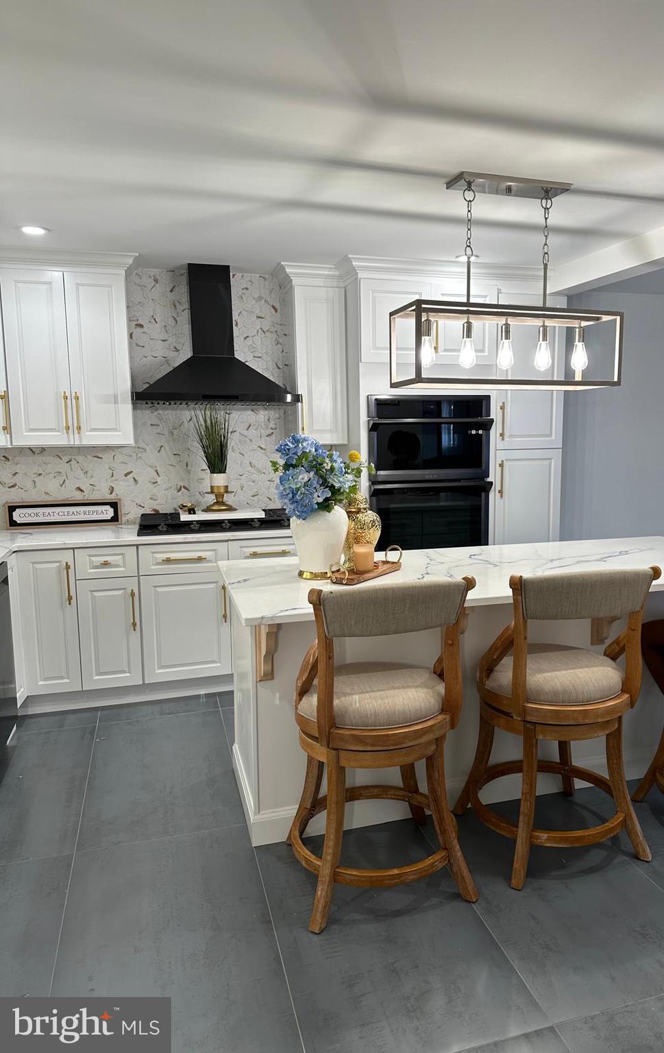 325 Wilson Road Blackwood, NJ 08012 - Photo 12 of 33 a kitchen with kitchen island a dining table and chairs