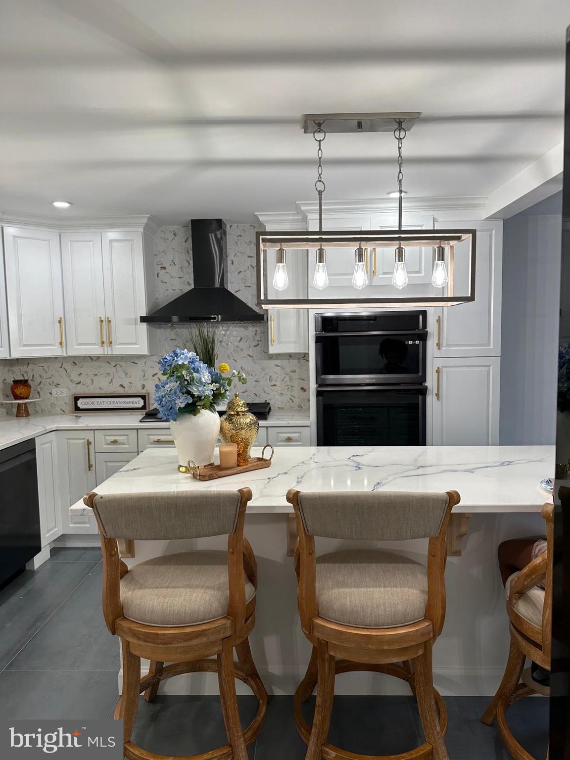 325 Wilson Road Blackwood, NJ 08012 - Photo 13 of 33 a kitchen with a stove a sink and chairs