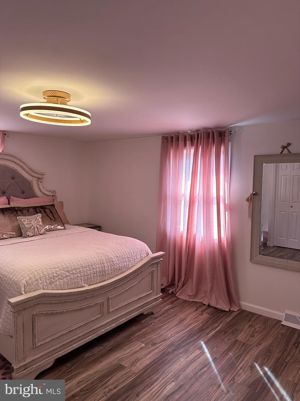 325 Wilson Road Blackwood, NJ 08012 - Photo 29 of 33 a bedroom with a bed and a chandelier