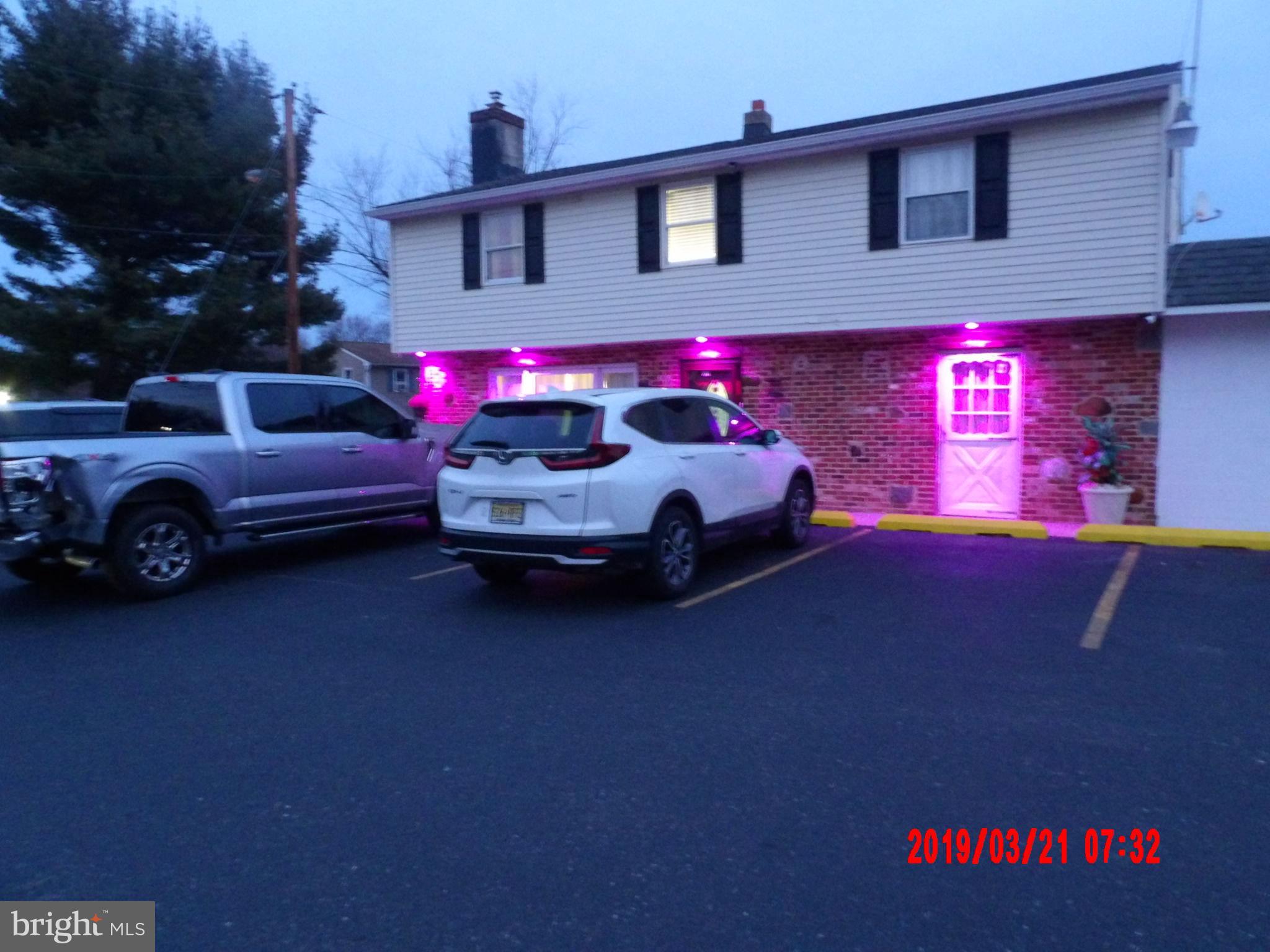 325 Wilson Road Blackwood, NJ 08012 - Photo 7 of 33 a car parked in front of a house