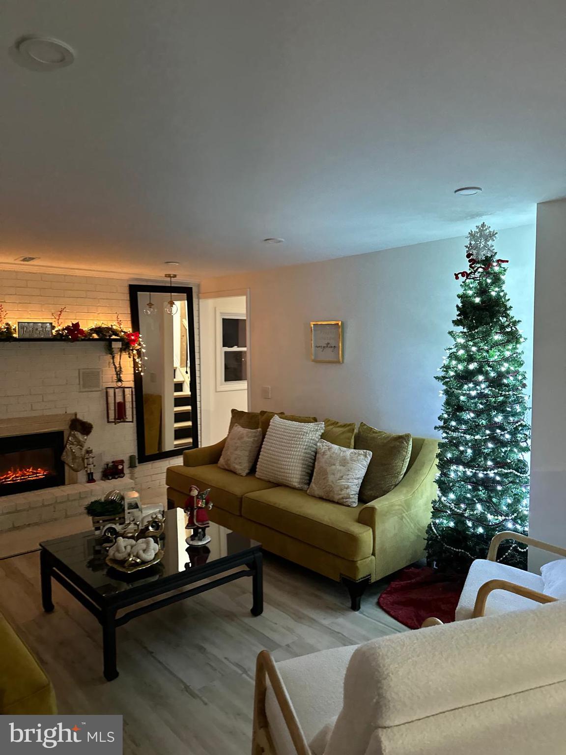 325 Wilson Road Blackwood, NJ 08012 - Photo 8 of 33 a living room with furniture plant and a fireplace