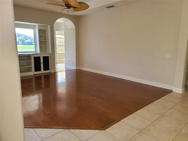 a large white kitchen with granite countertop a large white cabinets and a stove
