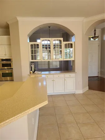 a kitchen with stainless steel appliances a refrigerator sink and microwave