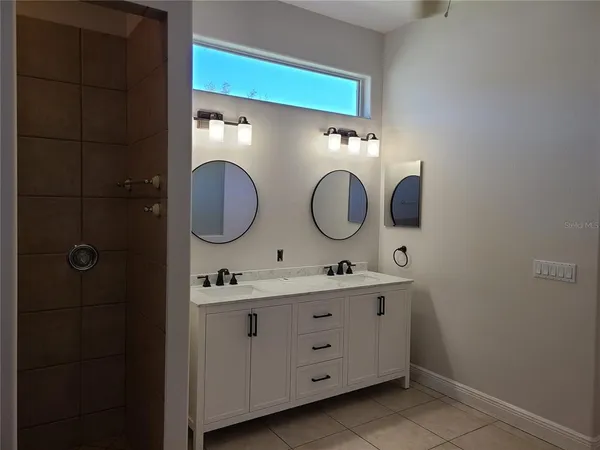 a bathroom with a sink toilet and mirror