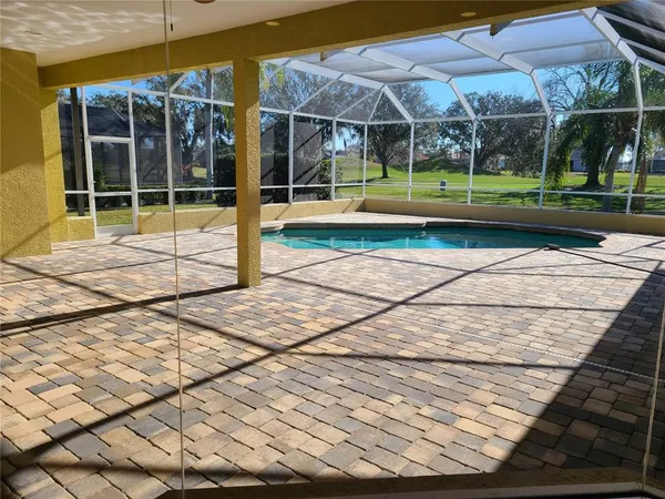 a view of empty room with windows