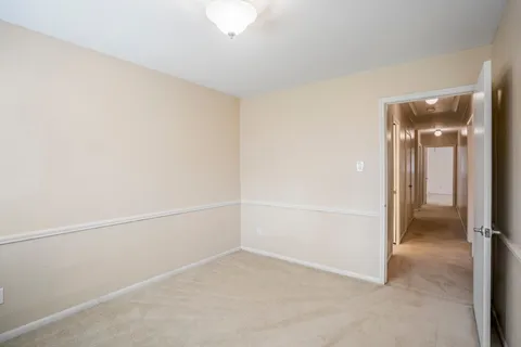 an empty room with a hallway