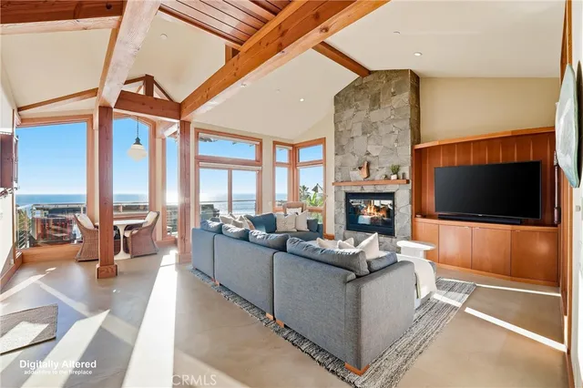 a living room with fireplace furniture and a flat screen tv