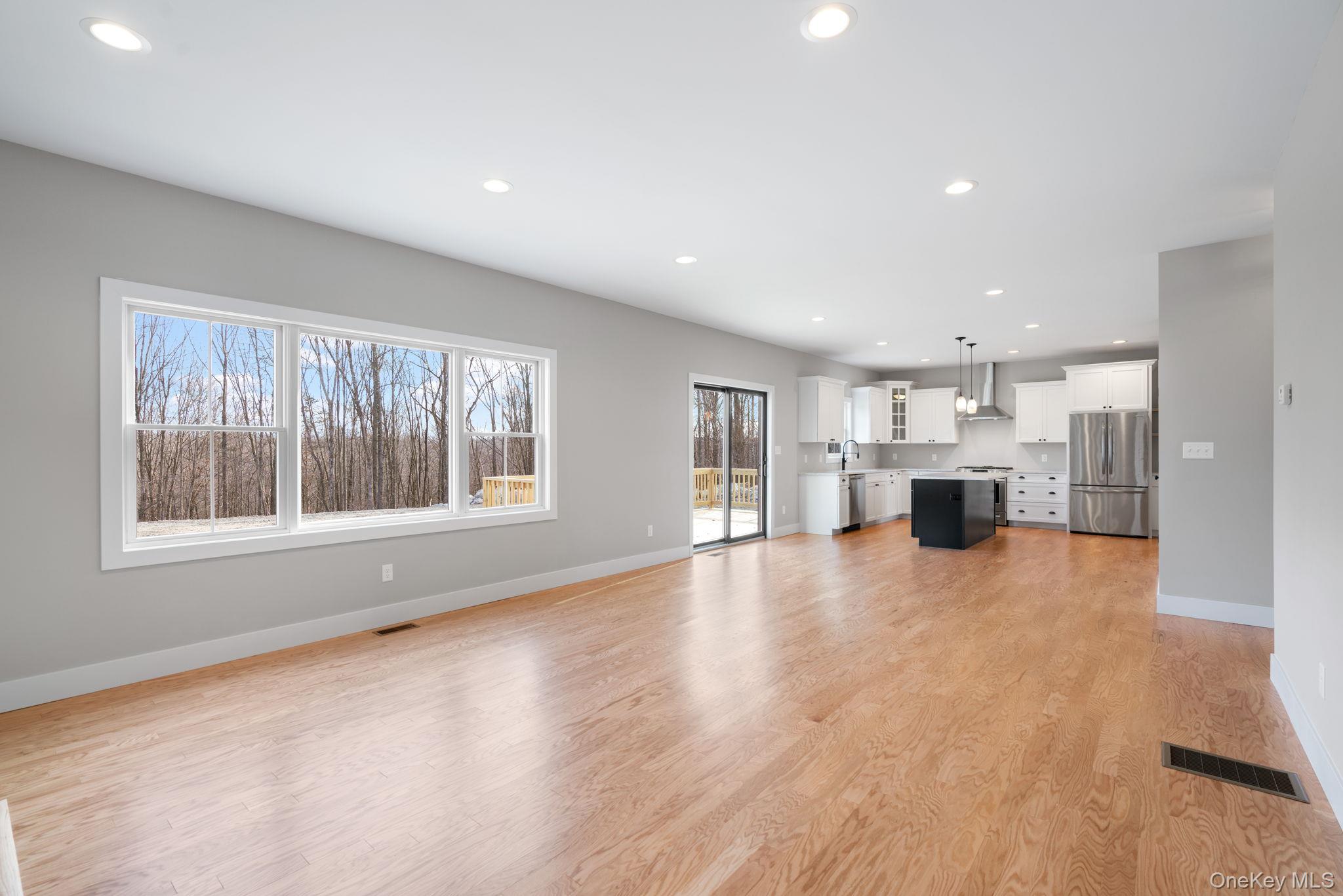 13 Harrier Ridge Drive Wallkill, NY 12589 - Photo 11 of 40 Unfurnished living room with recessed lighting and light wood finished floors