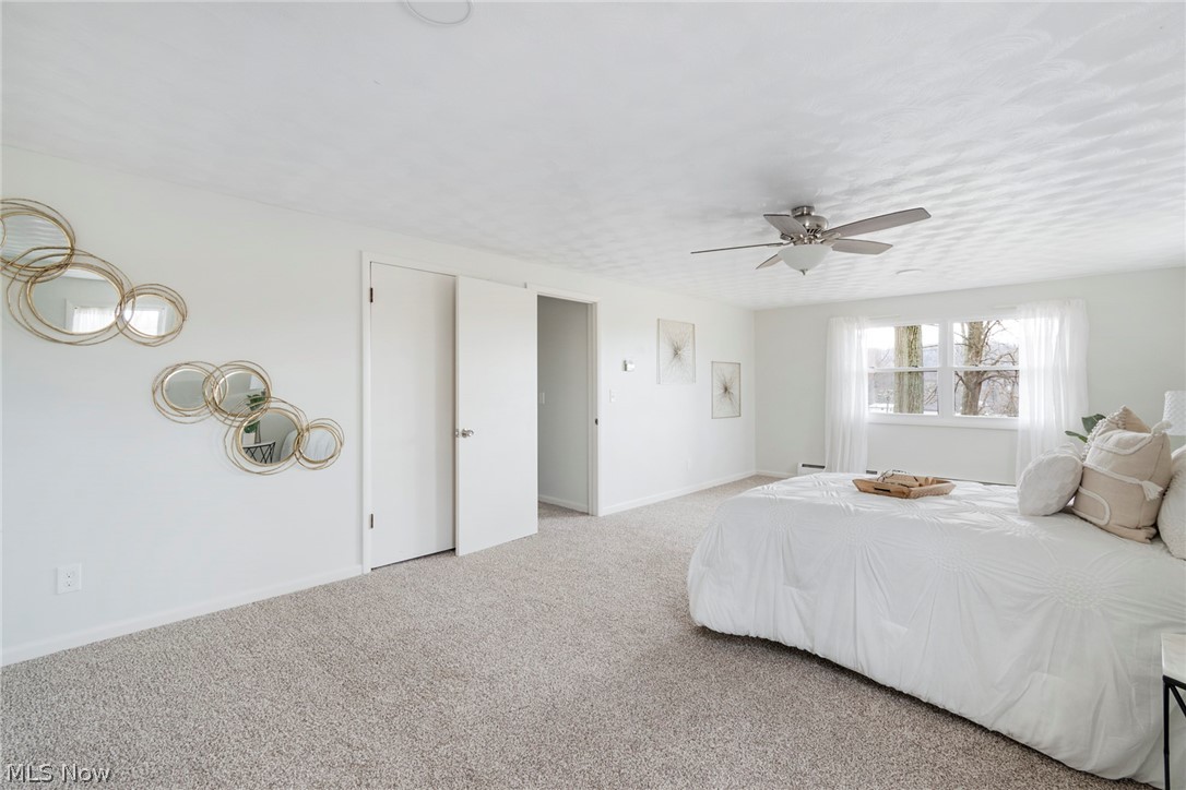 25005 West Egypt Road Minerva, OH 44657 - Photo 24 of 33 Unfurnished bedroom featuring light carpet and ceiling fan