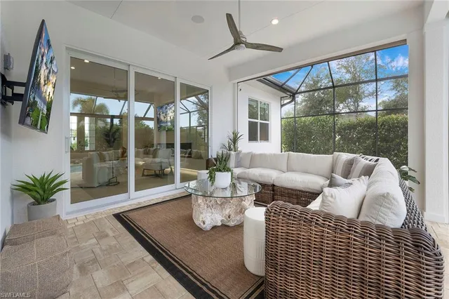 a kitchen with a table chairs and a barbeque