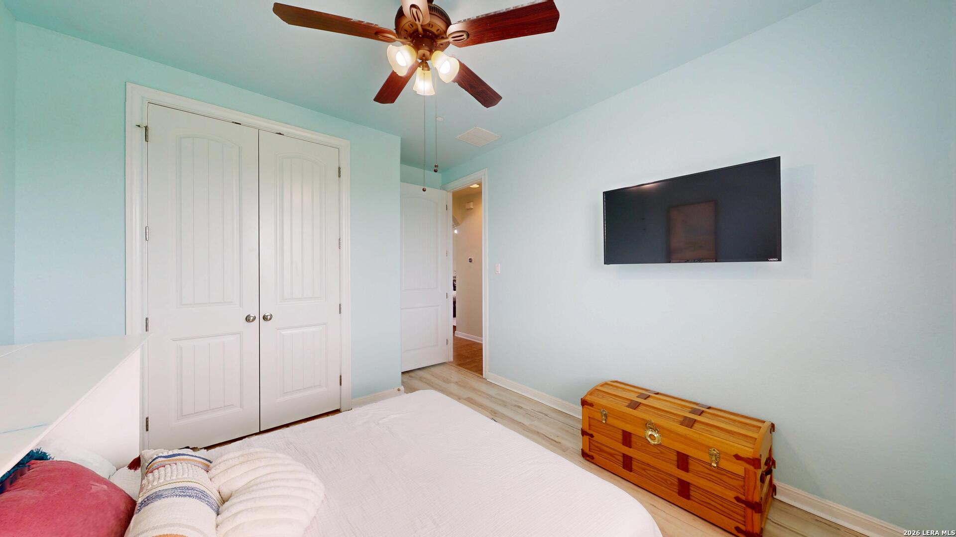 10111 Shallow Bank Converse, TX 78109 - Photo 35 of 65 a bedroom with a bed and a flat screen tv