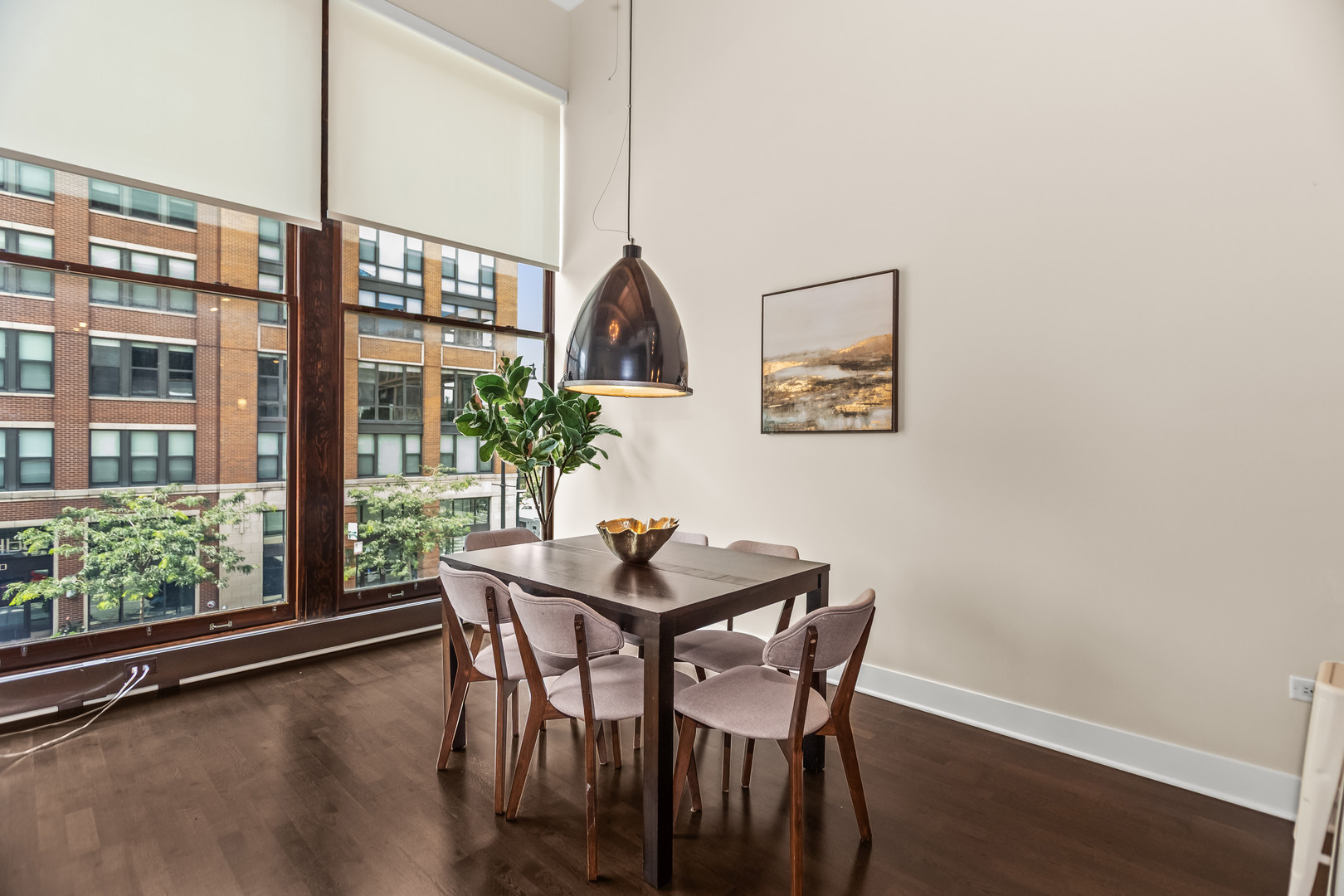 2303 South Michigan Avenue, Unit 208 Chicago, IL 60616 - Photo 6 of 21 a dining room with furniture and wooden floor