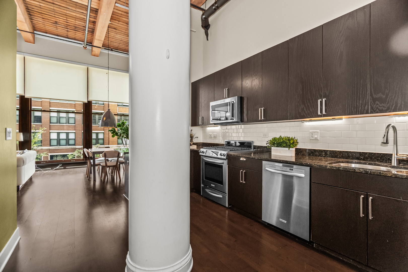 2303 South Michigan Avenue, Unit 208 Chicago, IL 60616 - Photo 8 of 21 a kitchen with stainless steel appliances granite countertop a stove a sink and a refrigerator