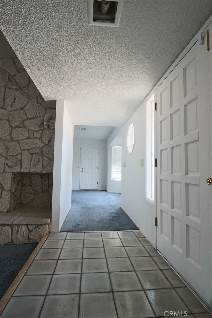 4752 Flying H Road Twentynine Palms, CA 92277 - Photo 20 of 55 a view of a livingroom with an empty space and window
