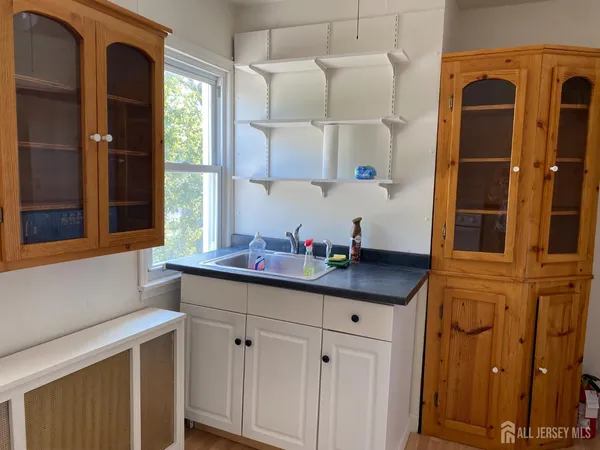a kitchen with stainless steel appliances a sink and cabinets