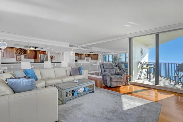 a view of a patio with a table and chairs