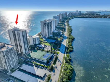 a bedroom with a bed and a computer on a desk