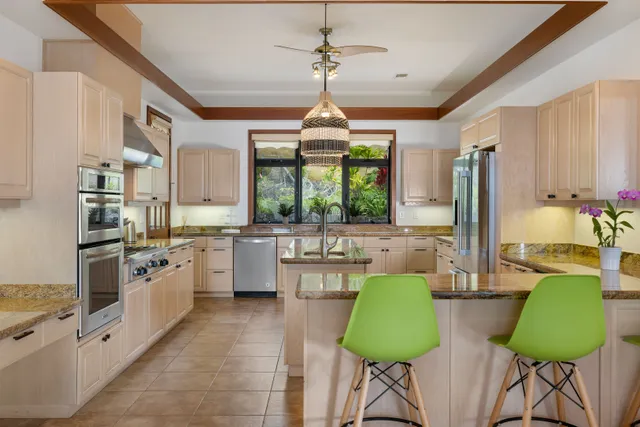 a bedroom with furniture and a large window