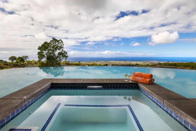 a view of a patio with swimming pool table and chairs