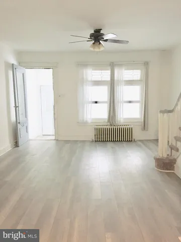 a view of a livingroom with wooden floor