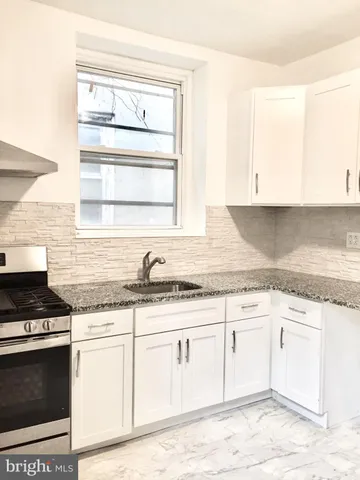 a view of wooden floor and a rug