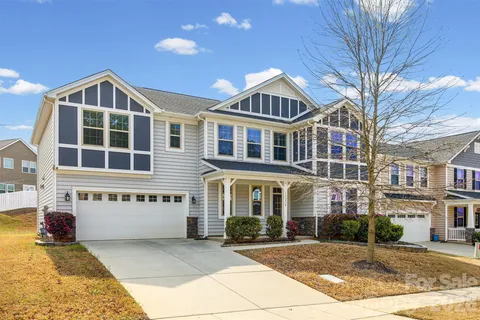 a front view of a building with a yard