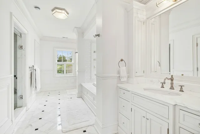 a bathroom with a sink double vanity and a shower