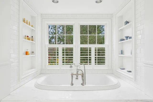a bathroom with sink and window