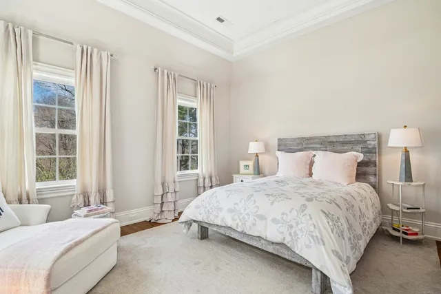 a bedroom with bed and a window