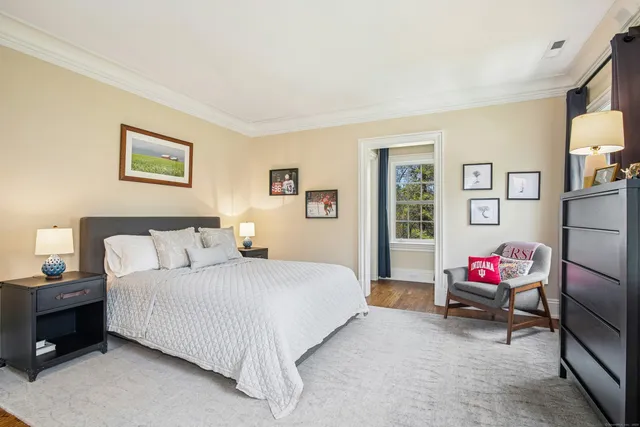 a bedroom with a bed and a couch