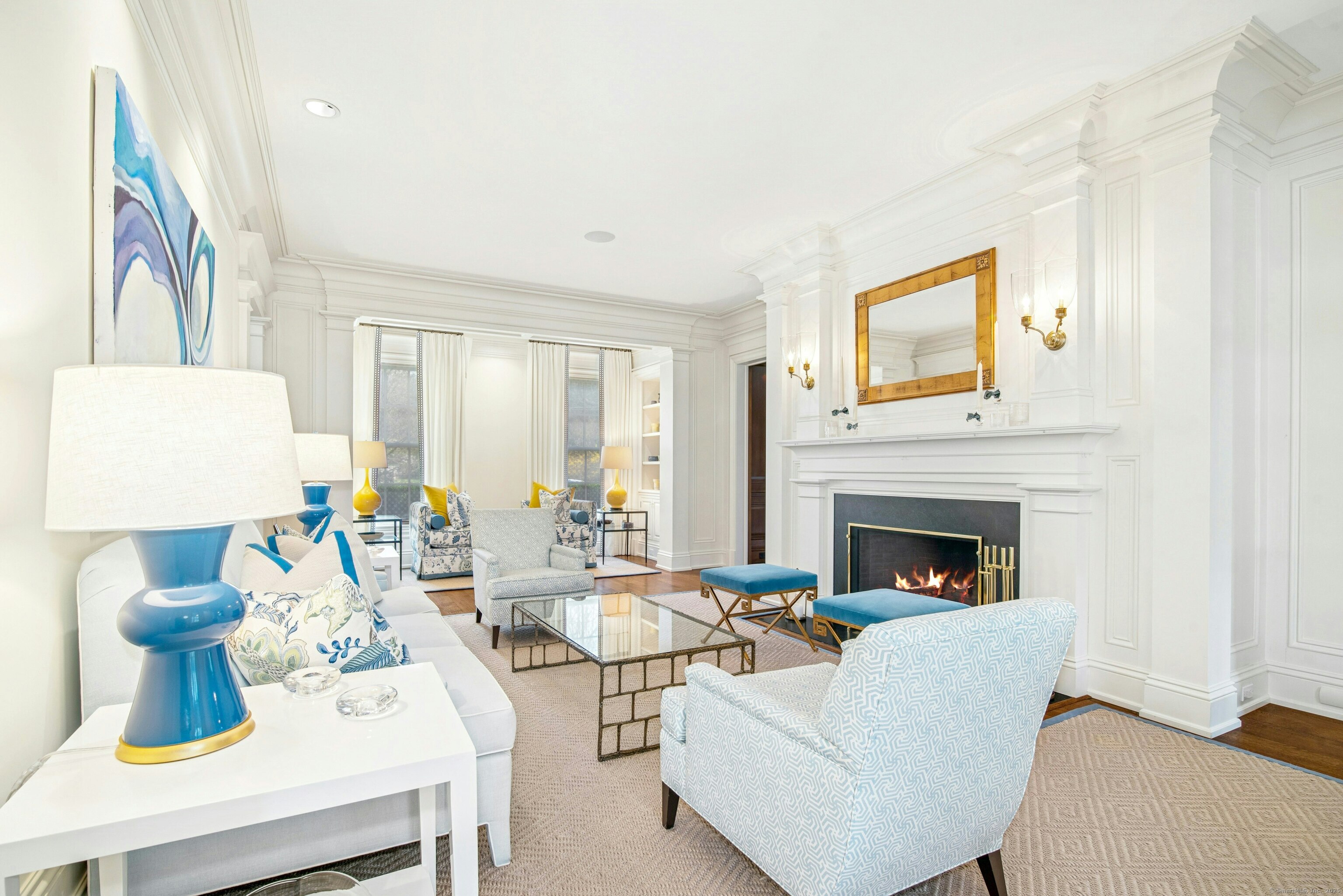 584 West Road New Canaan, CT 06840 - Photo 4 of 33 The gracious and spacious living room with fireplace has front to back views of the lovely grounds