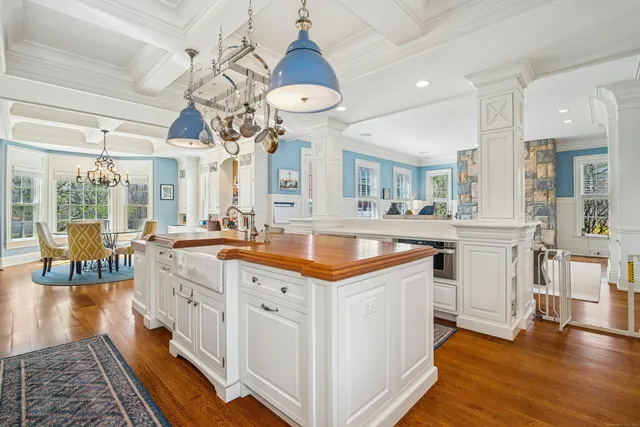a kitchen with stainless steel appliances granite countertop a sink and a stove